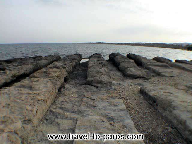 DRIOS - Wide and big stones with big lines in between which are the ruins of an ancient shipyard.