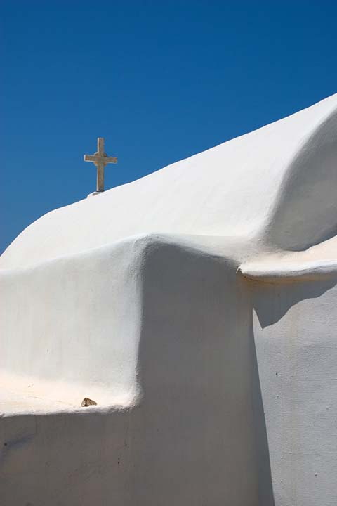 BLUE, WHITE AND A CROSS - A little chappel in the middle of nowhere in Paros. Just a part of it to show its simple form.